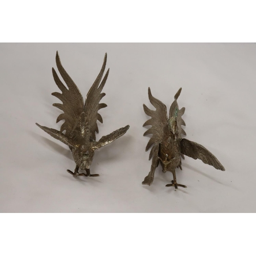 196 - A PAIR OF VINTAGE WHITE METAL FIGHTING COCKS