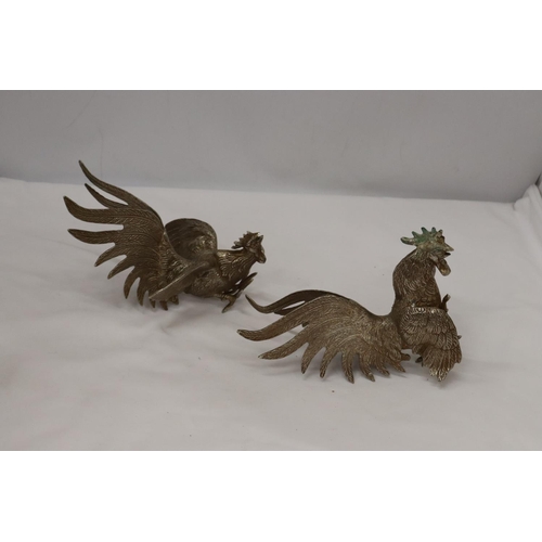 196 - A PAIR OF VINTAGE WHITE METAL FIGHTING COCKS