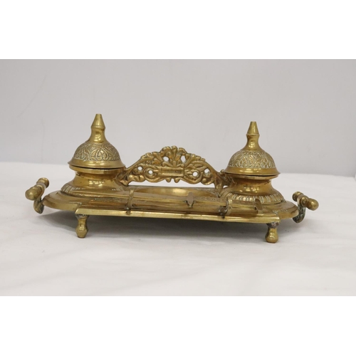 220 - AN ORNATE BRASS INKWELL AND LETTER OPENER