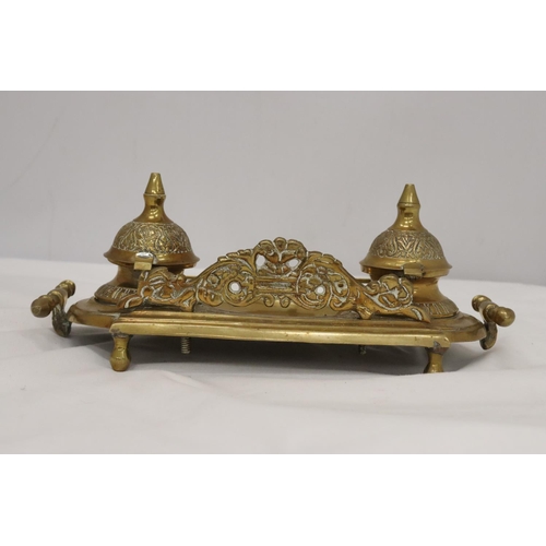 220 - AN ORNATE BRASS INKWELL AND LETTER OPENER