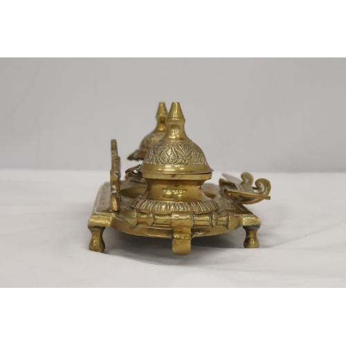 220 - AN ORNATE BRASS INKWELL AND LETTER OPENER