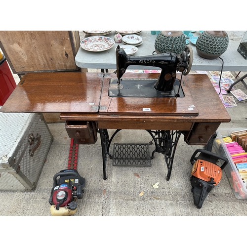 1694 - A VINTAGE SINGER SEWING MACHINE WITH OAK TABLE AND TREADLE BASE