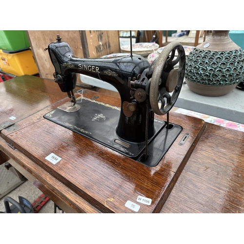 1694 - A VINTAGE SINGER SEWING MACHINE WITH OAK TABLE AND TREADLE BASE