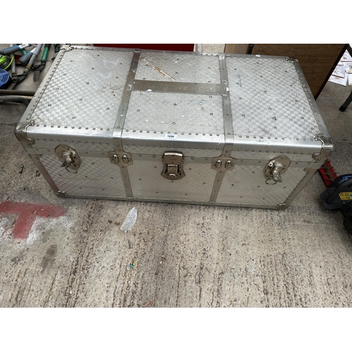 1696 - A LARGE ALUMINIUM COVERED TRAVEL TRUNK