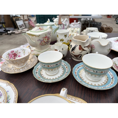 1704 - AN ASSORTMENT OF CERAMICS TO INCLUDE FOUR ROYAL WORCESTER PLACE SETTINGS WITH CUPS, SAUCER, SIDE PLA... 