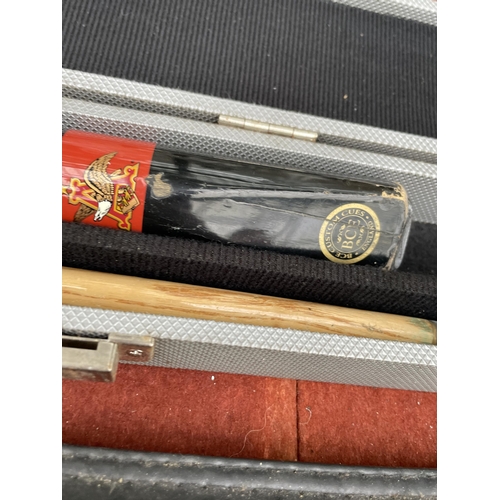 1601 - TWO CASED SNOOKER CUES TO INCLUDE A BCE CUSTOM CUE WITH BUDWIESER DESIGN ETC