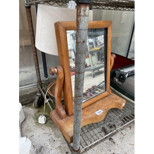 1608 - AN OAK SWING FRAME DRESSING TABLE MIRROR AND A DECORATIVE OAK TABLE LAMP