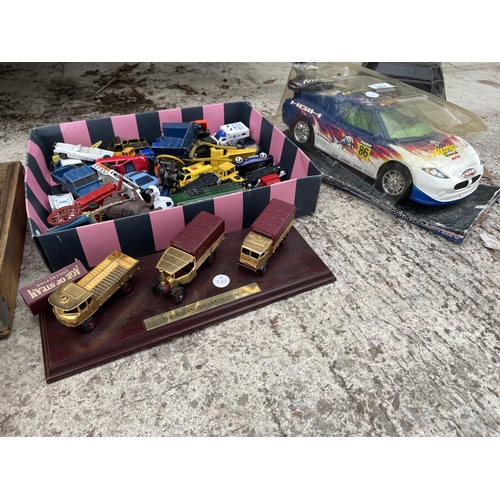 1611 - A LARGE ASSORTMENT OF MODEL VEHICLES AND TOYS TO INCLUDE CARS AND TRUCKS ETC