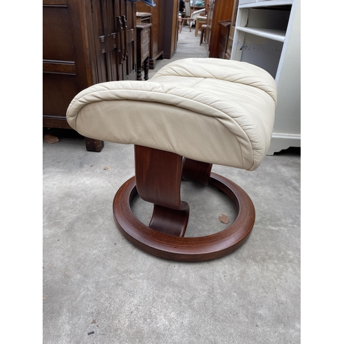 A STRESSLESS EKORNES SWIVEL ADJUSTABLE CHAIR AND STOOL