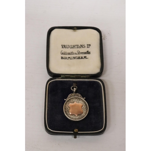 320 - A BIRMINGHAM HALLMARKED SILVER FOOTBALL MEDAL IN ITS ORIGINAL DERBYSHIRE FOOTBALL ASSOCIATION PRESEN... 