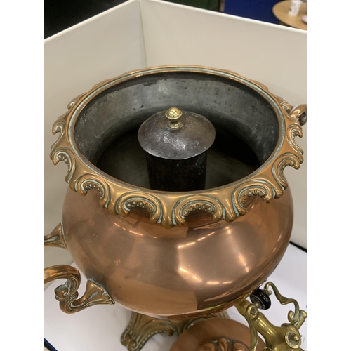 44 - A VINTAGE DECORATIVE COPPER AND BRASS SAMOVAR WITH WHITE HANDLES (ONE A/F)