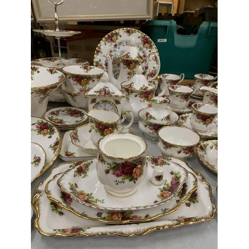 15 - A VERY LARGE COLLECTION OF ROYAL ALBERT OLD COUNTRY ROSES TO INCLUDE TRIOS, JUGS, SUGAR BOWLS, COFFE... 