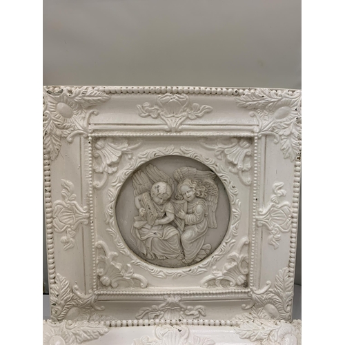 34 - TWO ORNATELY FRAMED SCULPTURES OF ANGELS