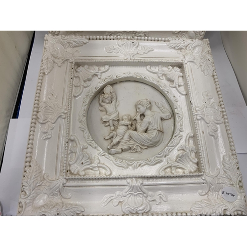 34 - TWO ORNATELY FRAMED SCULPTURES OF ANGELS