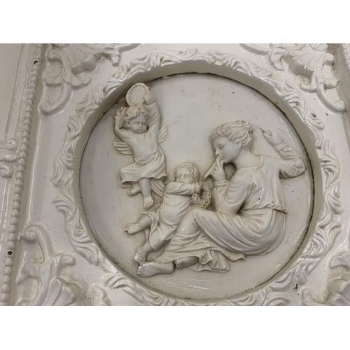 34 - TWO ORNATELY FRAMED SCULPTURES OF ANGELS