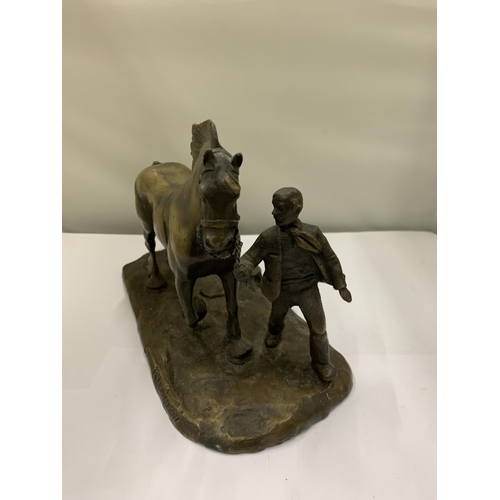 38 - A BRONZE FIGURE OF A MAN WITH A HEAVY HORSE SIGNED R DONALDSON