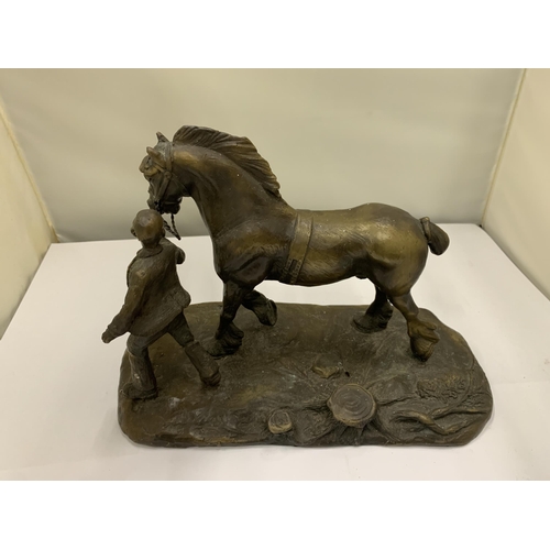 38 - A BRONZE FIGURE OF A MAN WITH A HEAVY HORSE SIGNED R DONALDSON