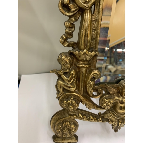 7 - A MIRROR WITH A HEAVY BRASS DECORATIVE FRAME HEIGHT 36CM