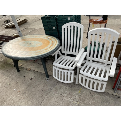 1852 - TWO PLASTIC FOLDING GARDEN CHAIRS AND A PLASTIC GARDEN TABLE