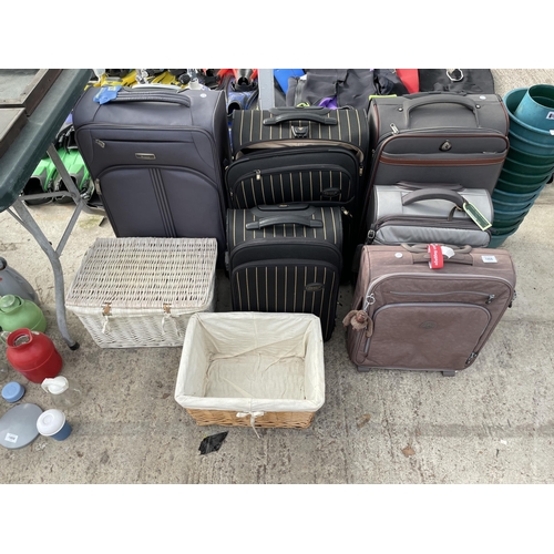 1866 - AN ASSORTMENT OF SUITCASES AND WICKER BASKETS ETC