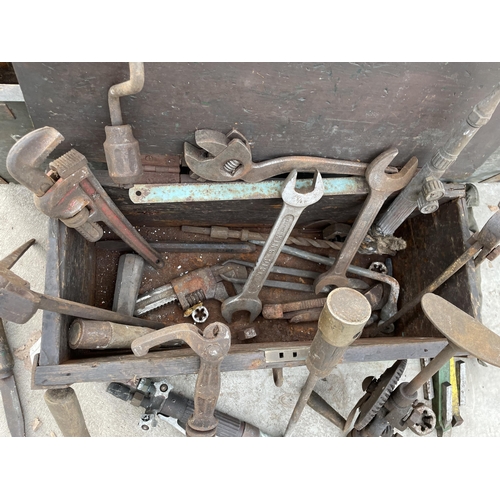 1902 - TWO WOODEN TOOL BOXES WITH AN ASSORTMENT OF TOOLS TO INCLUDE BRACE DRILLS, HAMMERS AND SPANNERS ETC