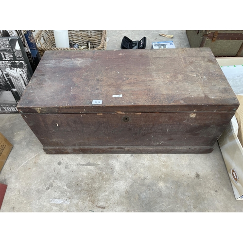 1919 - A LARGE WOODEN TOOL CHEST WITH AN ASSORTMENT OF TOOLS TO INCLUDE SPANNERS AND STILSENS ETC