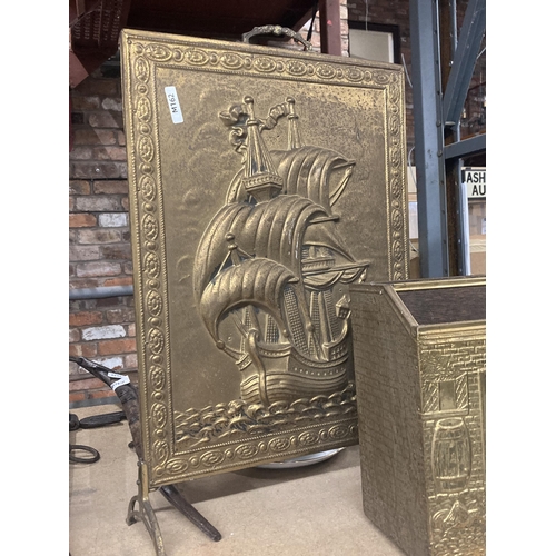 1068 - TWO DECORATIVE BRASS ITEMS TO INCLUDE A FIRE SCREEN AND MAGAZINE RACK