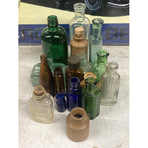 1090 - A LARGE QUANTITY OF VARIOUS COLOURED VINTAGE GLASS BOTTLES