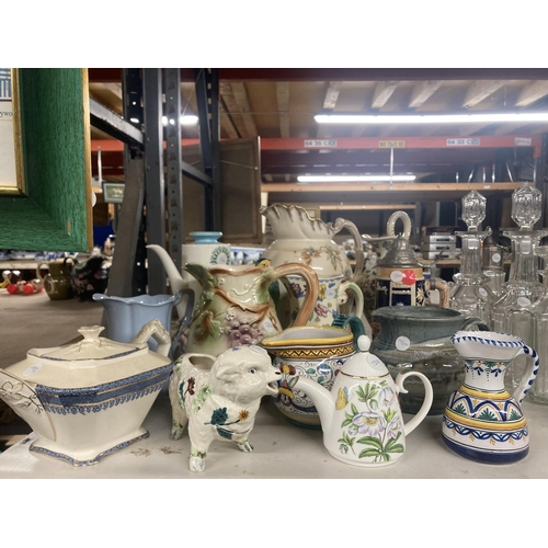 1113 - A COLLECTION OF VARIOUS CERAMIC JUGS AND TEAPOTS ETC