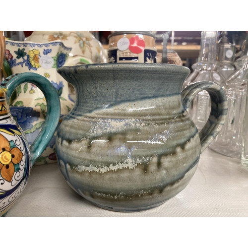 1113 - A COLLECTION OF VARIOUS CERAMIC JUGS AND TEAPOTS ETC