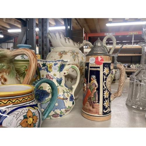 1113 - A COLLECTION OF VARIOUS CERAMIC JUGS AND TEAPOTS ETC