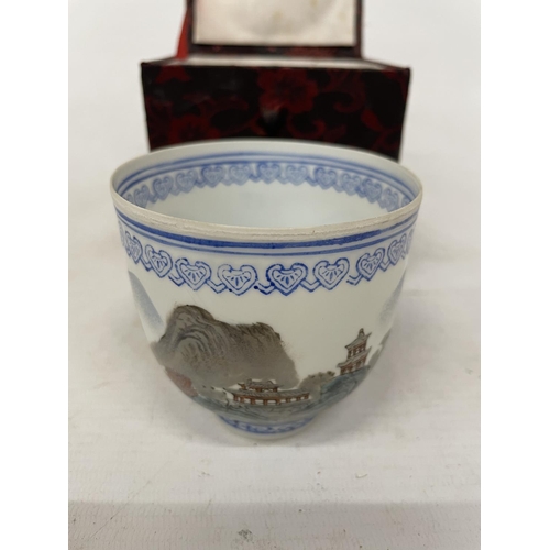 76 - A CHINESE EGGSHELL PAPER THIN PORCELAIN HAND PAINTED CUP WITH POLYCHROME LANDSCAPE DECORATION