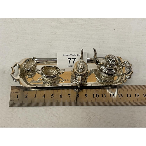 77 - A MINATURE HALLMARKED BIRMINGHAM SILVER TEASET ON A TRAY