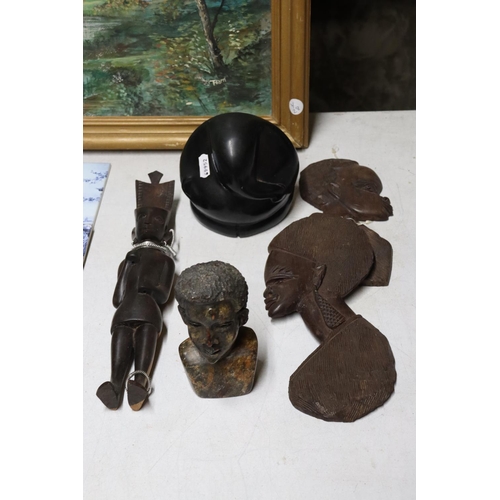 1263 - TWO WOODEN AFRICAN STYLE WALL PLAQUES, A HEAVY STONE AFRICAN BUST, ETC 5 IN TOTAL