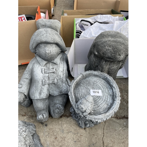 149 - FIVE VARIOUS CONCRETE GARDEN FIGURES TO INCLUDE DOBBIE AND PADDINGTON BEAR ETC NO VAT TO BE SOLD FOR... 