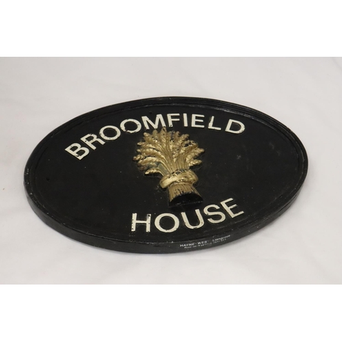 219 - A CAST IRON HOUSE SIGN, 39CM X 28CM