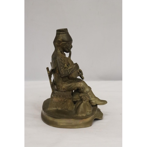 258 - A BRASS SEATED MUSICIAN