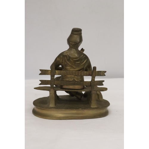 258 - A BRASS SEATED MUSICIAN