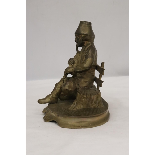 258 - A BRASS SEATED MUSICIAN