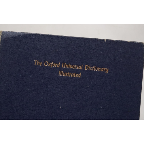 276 - A PAIR OF OXFORD UNIVERSAL DICTIONARY'S IN METAL STAND