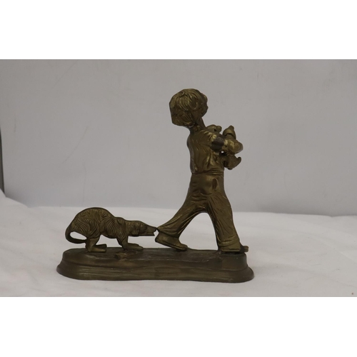 285 - A BRASS FIGURE OF A BOY WITH PUPPY DOGS, HEIGHT 20CM, WIDTH 20CM TOGETHER WITH A BRASS LADEL