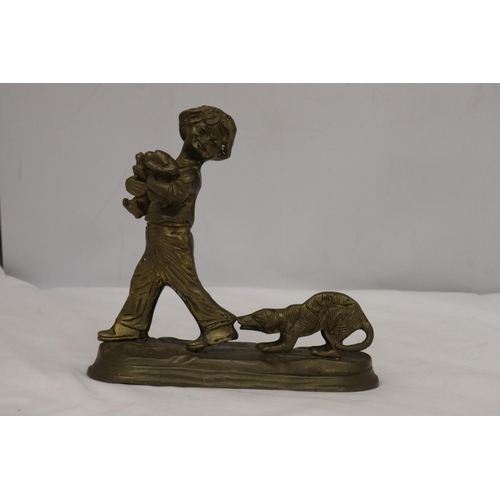 285 - A BRASS FIGURE OF A BOY WITH PUPPY DOGS, HEIGHT 20CM, WIDTH 20CM TOGETHER WITH A BRASS LADEL