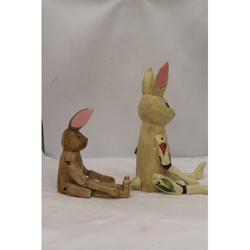 296 - TWO WOODEN SHELF RABBITS