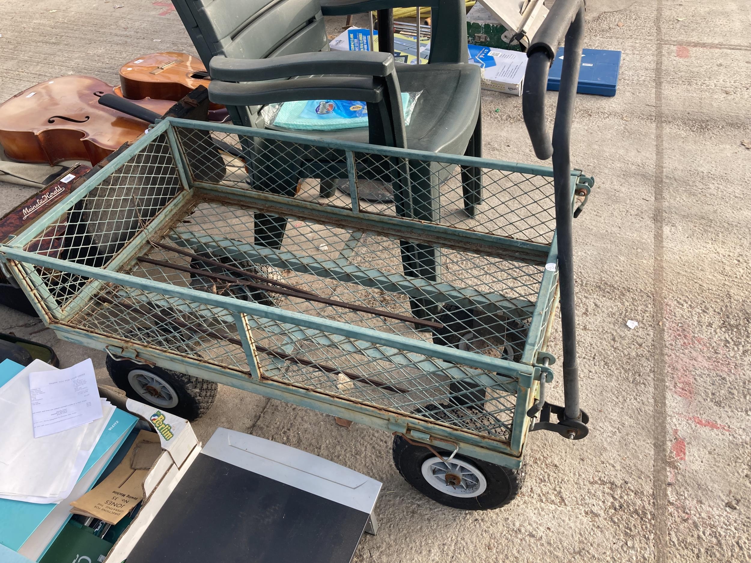 A METAL FOUR WHEELED MARKET GARDENERS TROLLEY AND TWO PLASTIC STACKING ...