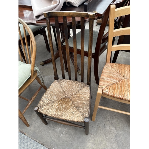 3276 - TWO BEECH DINING CHAIRS WITH RUSH SEATS AND AN OAK NURSING CHAIR WITH RUSH SEAT