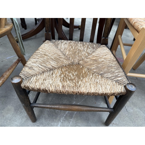 3276 - TWO BEECH DINING CHAIRS WITH RUSH SEATS AND AN OAK NURSING CHAIR WITH RUSH SEAT