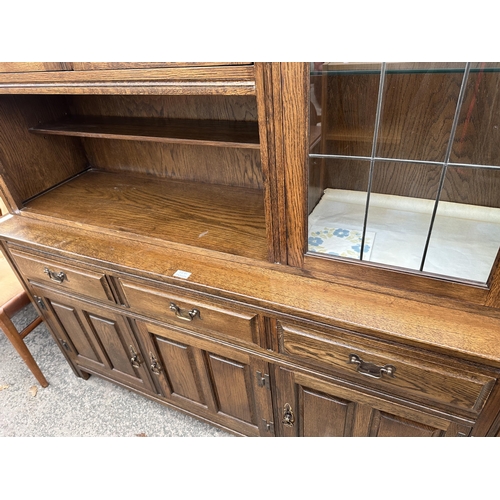 3281 - A WADE FURNITURE CABINET WITH  THREE UPPER DOORS AND THREE DOORS AND THREE DRAWERS