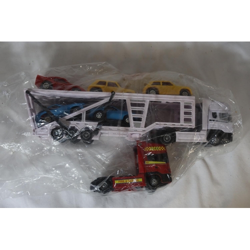 347 - TWO LARGE TOY WRECKER TRUCKS, A TOY SCANIA CAR TRANSPORTER AND CARS AND A BOXED WELLY 20 PIECE TOY C... 