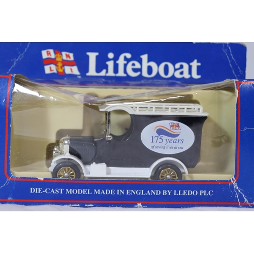 357 - SIX BOXED VEHICLES TO INCLUDE AN RNLI LIFEBOAT, ERTL COLLECTIBLES, DIECAST TAXI'S ETC.,