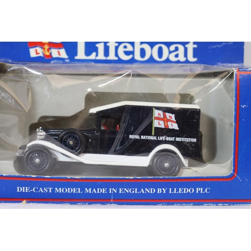 357 - SIX BOXED VEHICLES TO INCLUDE AN RNLI LIFEBOAT, ERTL COLLECTIBLES, DIECAST TAXI'S ETC.,